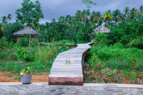 Wooden boardwalk with The Glade sign
